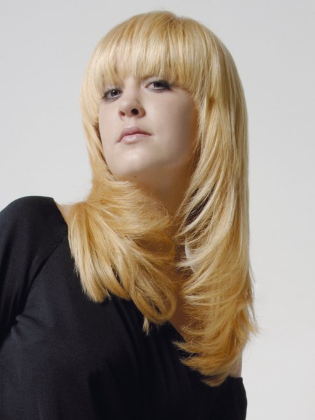 Long tapered razor-cut hair