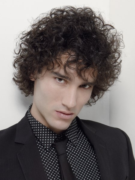 Neck-length hairstyle with wild curls for men