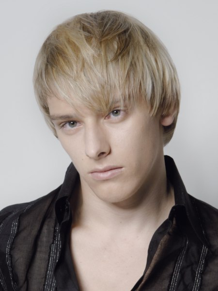 Blonde haircut with layers and diagonal bangs for men