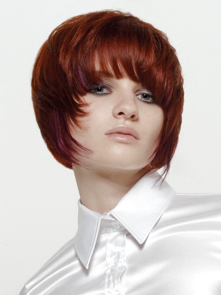 Buttoned-up satin blouse and short red hair