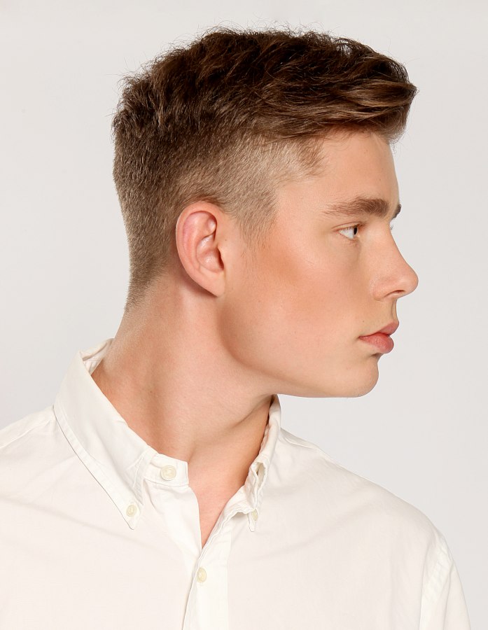 Clean retro haircut  with short  buzzed sides  and longer 