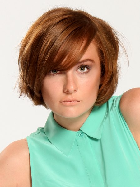 Short bob hairstyle with bangs across the forehead