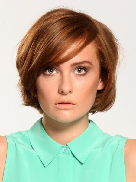 Short layered bob with bangs and sleek styling