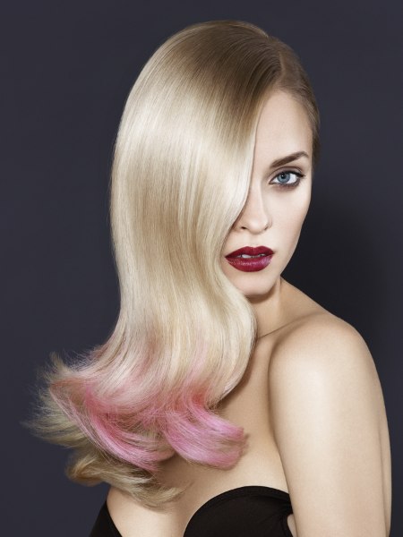Long blonde hair with a pink color accent