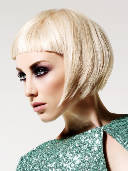 Short blonde bob cut with forward jutting sides