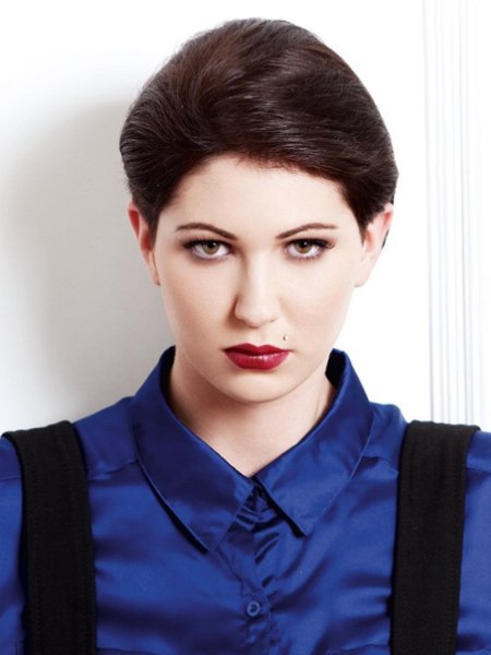 Short hair and a buttoned-up blouse collar