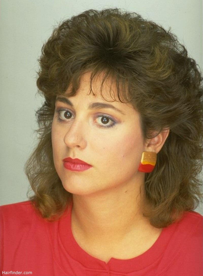 Medium length permed hair with shorter crown areas for pouf Medium length permed hair with shorter crown areas for pouf