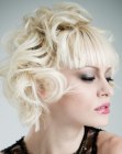Blonde hair with a combination of sleek bangs and curls