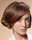 Short Parisian haircut with ends that are curled inward