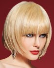 Blonde chin-length bob hairstyle with bangs