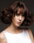 Short hairstyle with a sleek top and curled ends