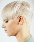 Very short sides and clipper cut back hairstyle for women