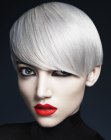 Platinum blonde hairstyle that covers half the ear