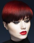 Smooth round cut with a deep red hair color
