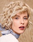 Contemporary short hairstyle with finger-styled curls and waves