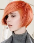 Jaw length bob with a flaming orange hue