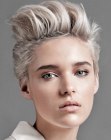 Short 1980s inspired hairstyle with uplifting of the top hair