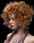 Copper hair with layering and defined curls for volume