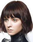 Brunette chin length bob with eyebrow-length bangs