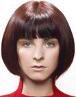 Sleek chin length bob with a rounded shape and bangs