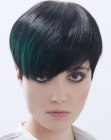 Short black hair with sleek styling and green streaks