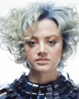 Triangular layered hairstyle with large silvery blue curls