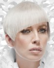 Precision cut platinum blonde hair with an asymmetrical line