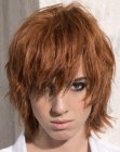 Short shag haircut with heavy texture and split bangs