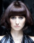 Smooth and glossy bob with big curls at the ends of the hair