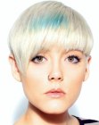 Short platinum blonde hair with blue streaks