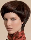 Short haircut with a sleek neck and a curved line around the face