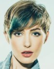 Dark blonde pixie cut with blue streaks