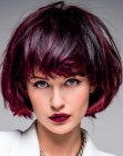 Wine red hair cut into an almost chin length bob
