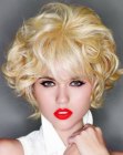 Short blonde hair with large vintage curls and bangs