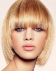 Ageless blonde bob with tapered sides and impeccable blunt bangs
