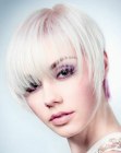 Short ingenious haircut for platinum blonde hair with a colored underbody