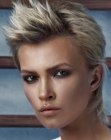 Mullet inspired haircut with combed back sides for women