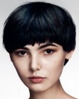 Short round haircut with unique bangs and a textured cutting line