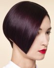 Sleek short hair with a forward plunging cutting line