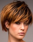 Short round bob with choppy texture and two tone hair coloring