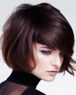 Light short hairstyle with a round shape and long side bangs