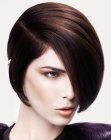 Short hair with a low side part and much volume