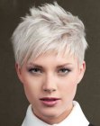 Blonde pixie cut with layering and slanted bangs