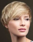 Modern pixie haircut with the ears partly covered