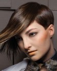 Contemporary pixie cut with an exaggerated razored fringe