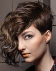 Edgy pixie cut with exaggerated bangs and curls