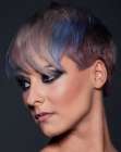 Pixie cut with very short sides and cool hair colors