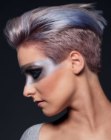 Pixie cut with buzzed sides and a play of different hair colors