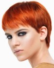 Classic pixie cut with clean cutting lines and full bangs