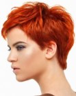 Fashionable pixie cut with a side fringe for red hair